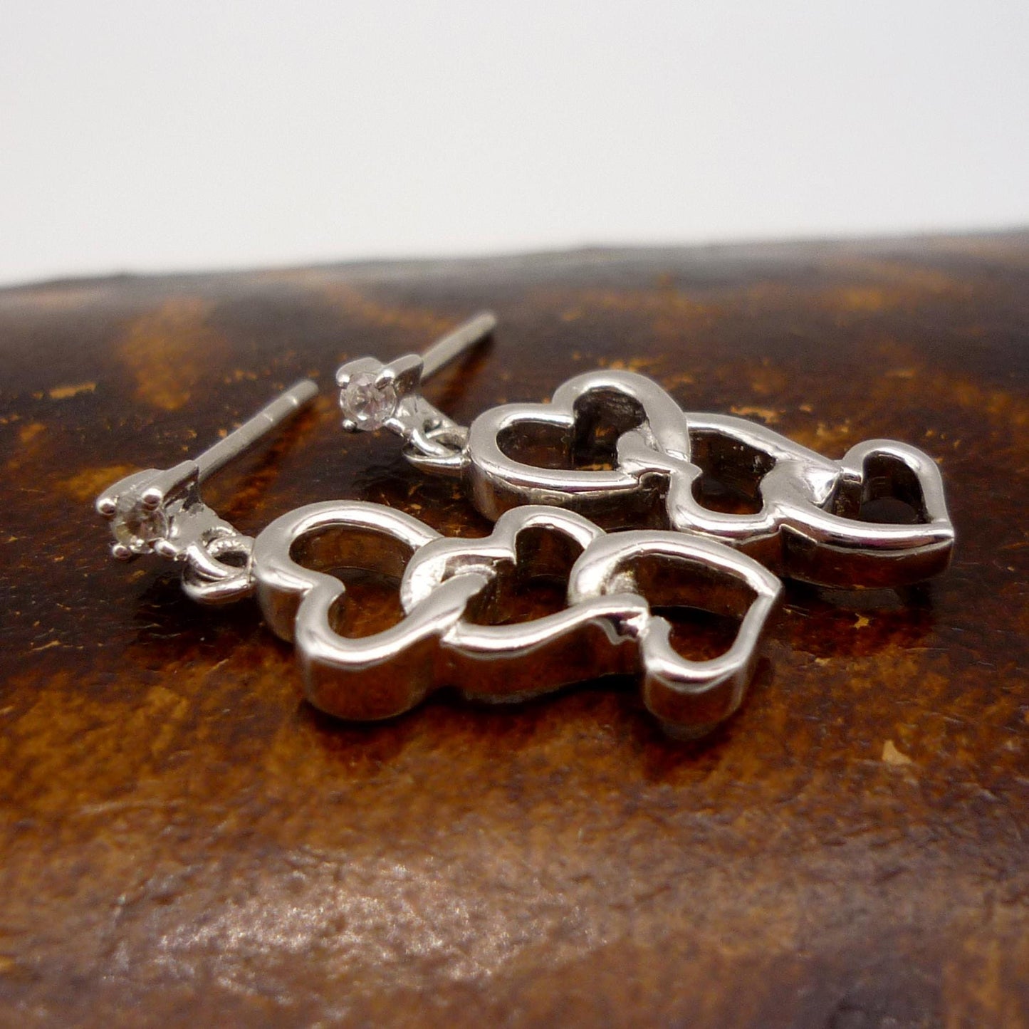 Sterling Silver Dangle Interlocking Heart Earrings with Small Zircon Studs