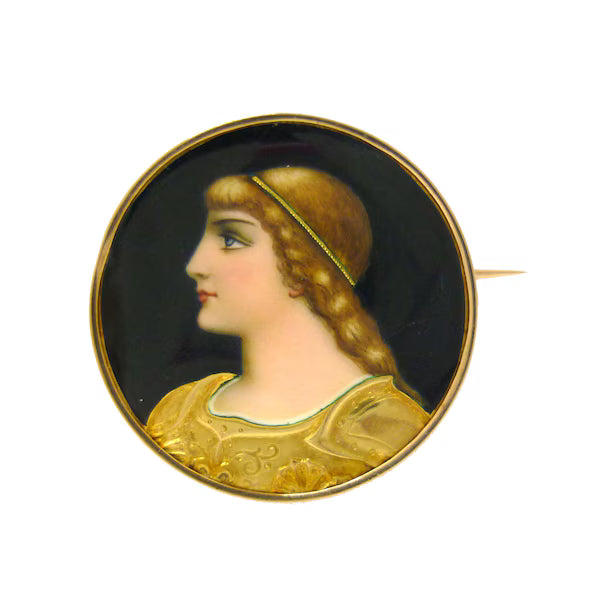 Antique French miniature portrait brooch in enamel & 18k gold. Depicts a side profile of Joan of Arc, embossed in engraved gold armour, with her hair braided and wearing a thin gold crown. 