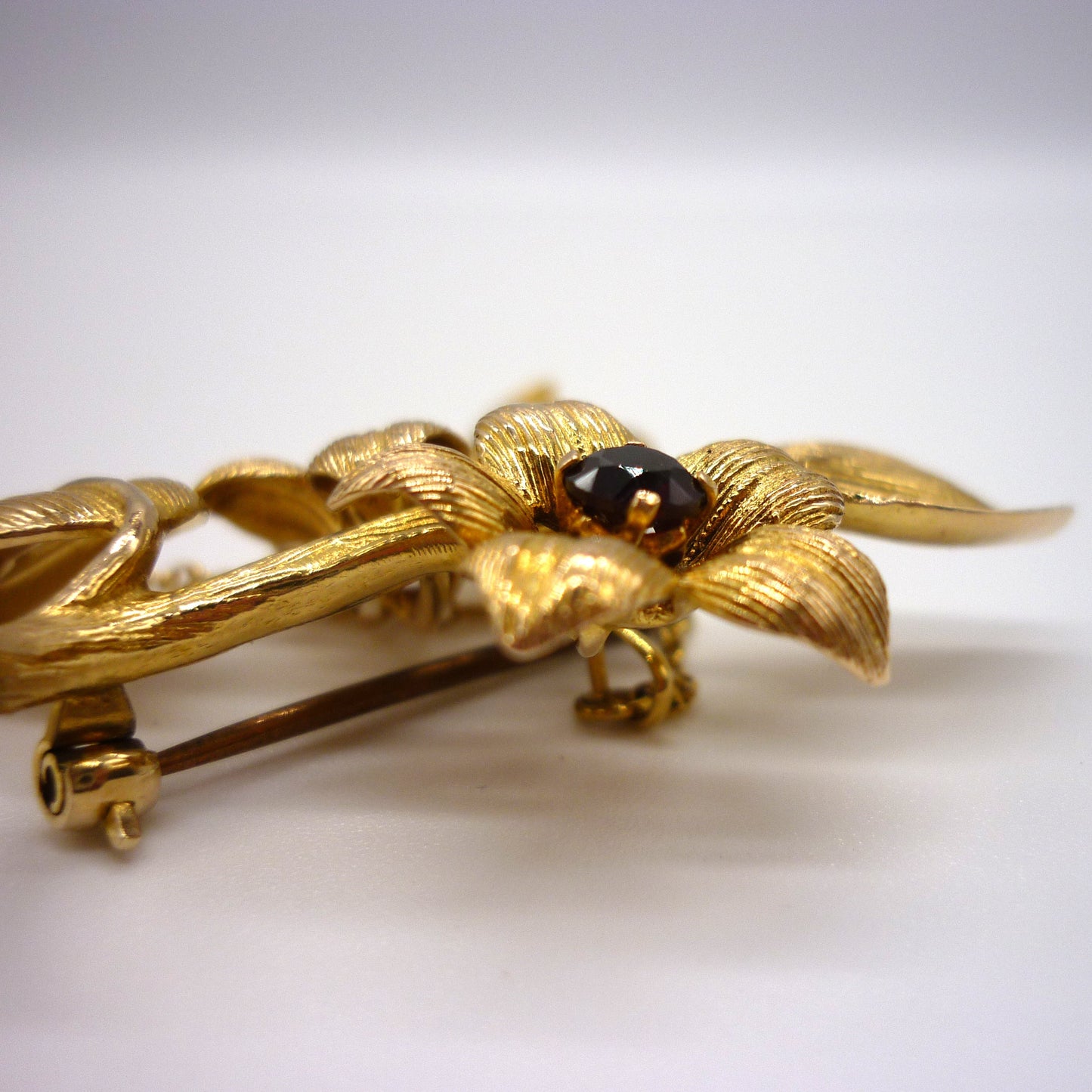 Gold Flower Brooch set with Garnets