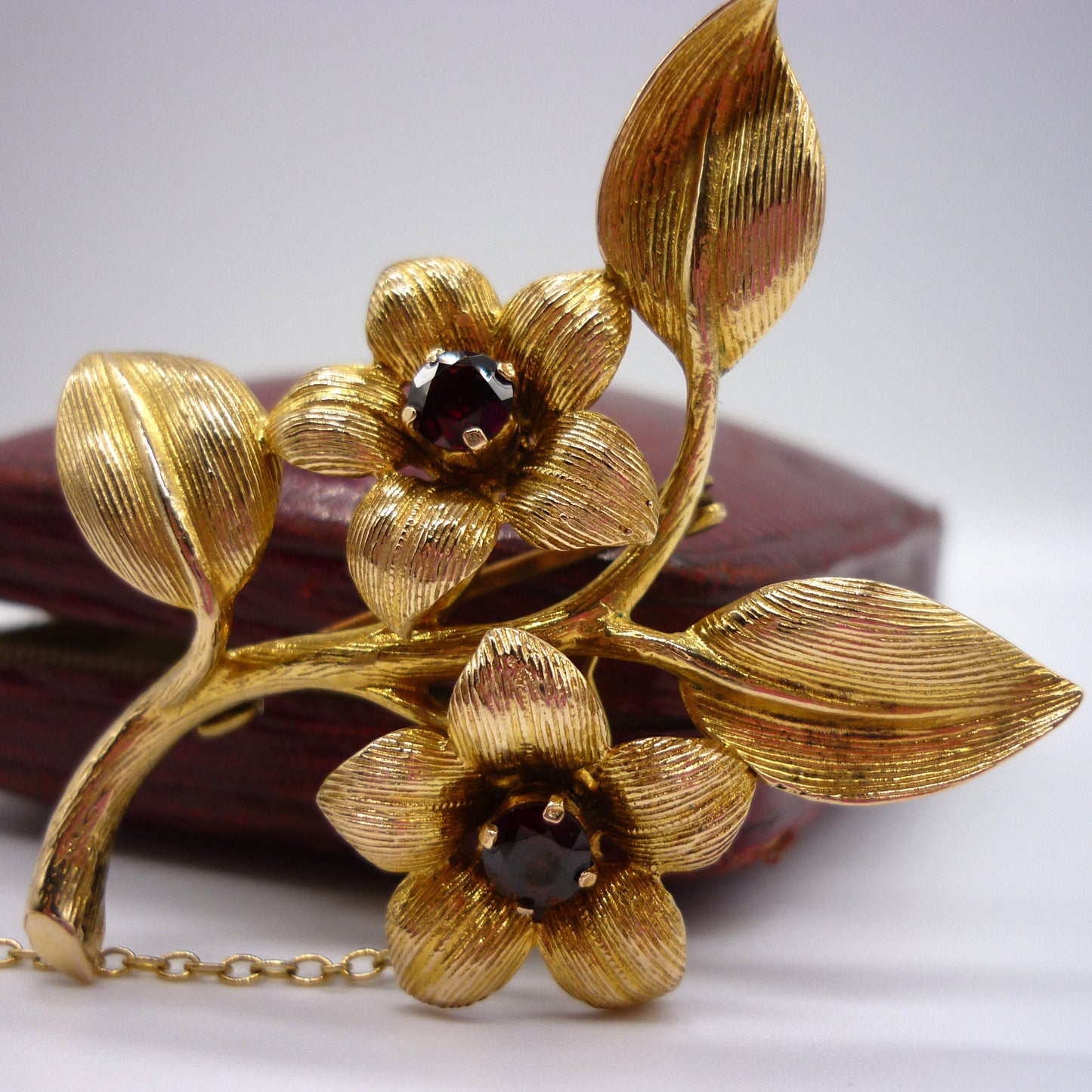 Gold Flower Brooch set with Garnets