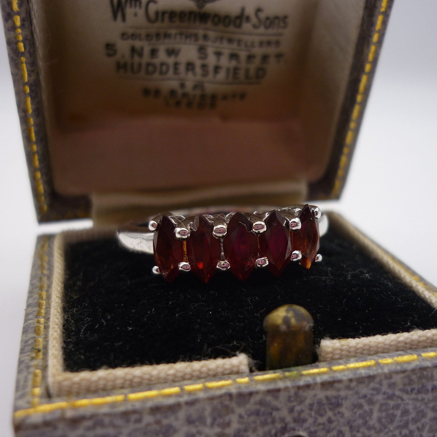 Silver Ring set with 5 Orange Toned Garnets