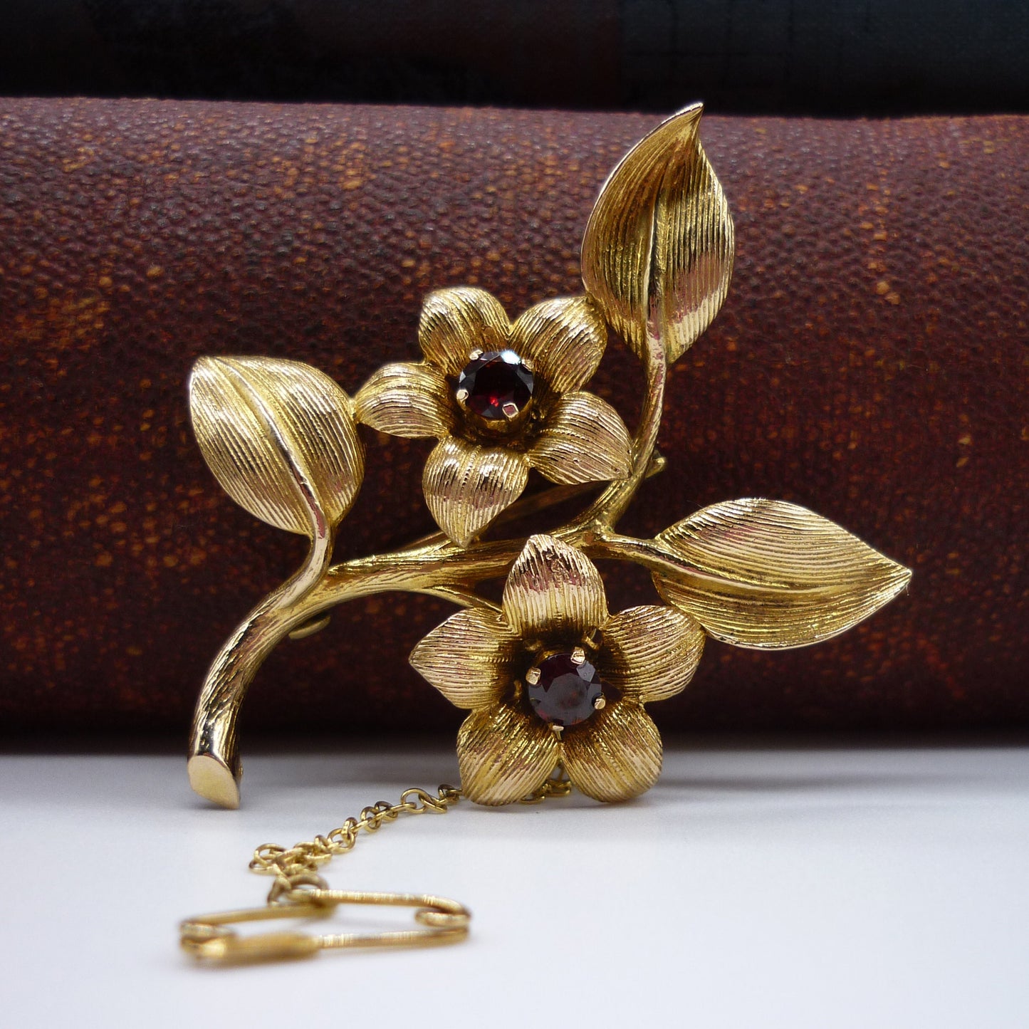 Gold Flower Brooch set with Garnets