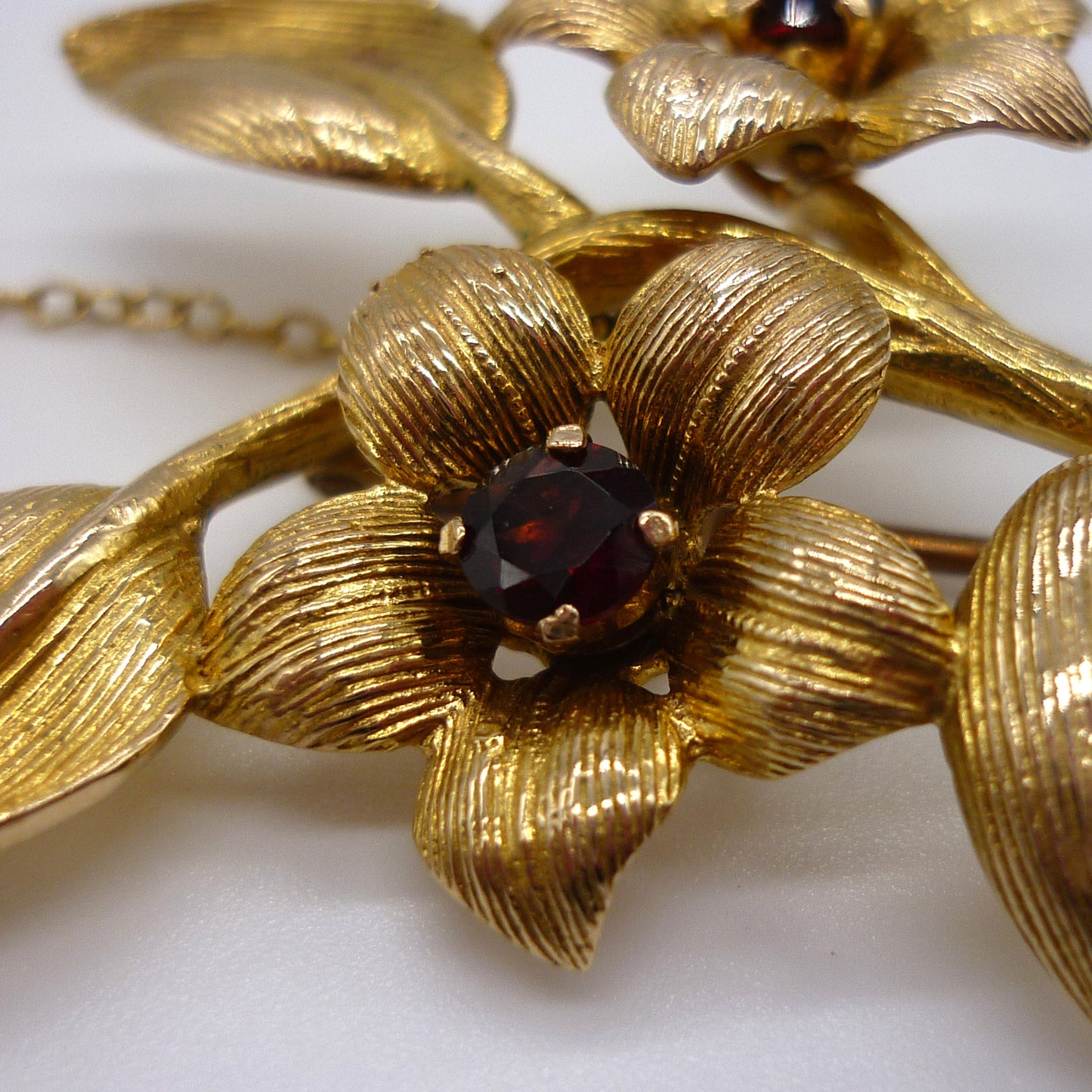 Gold Flower Brooch set with Garnets