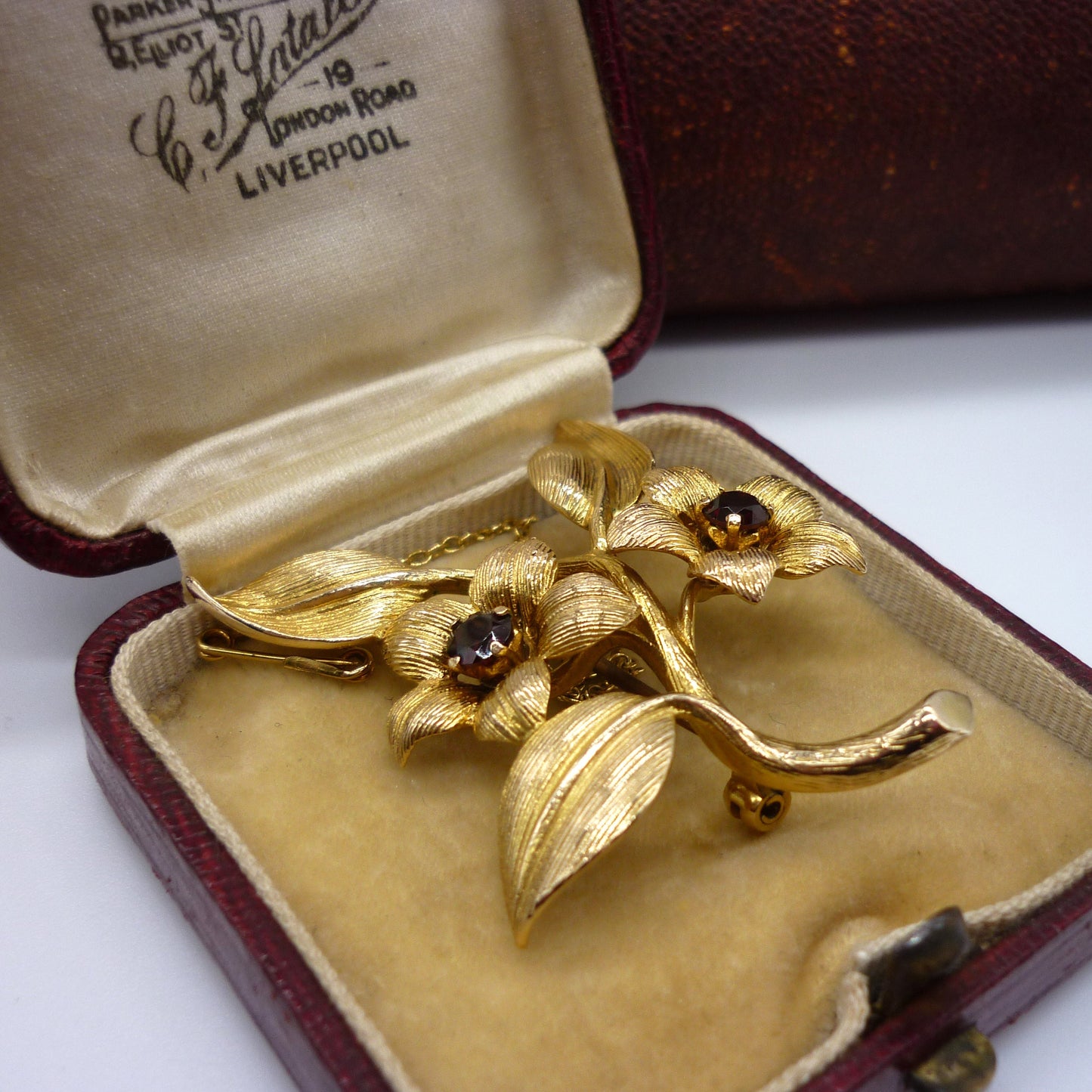 Gold Flower Brooch set with Garnets