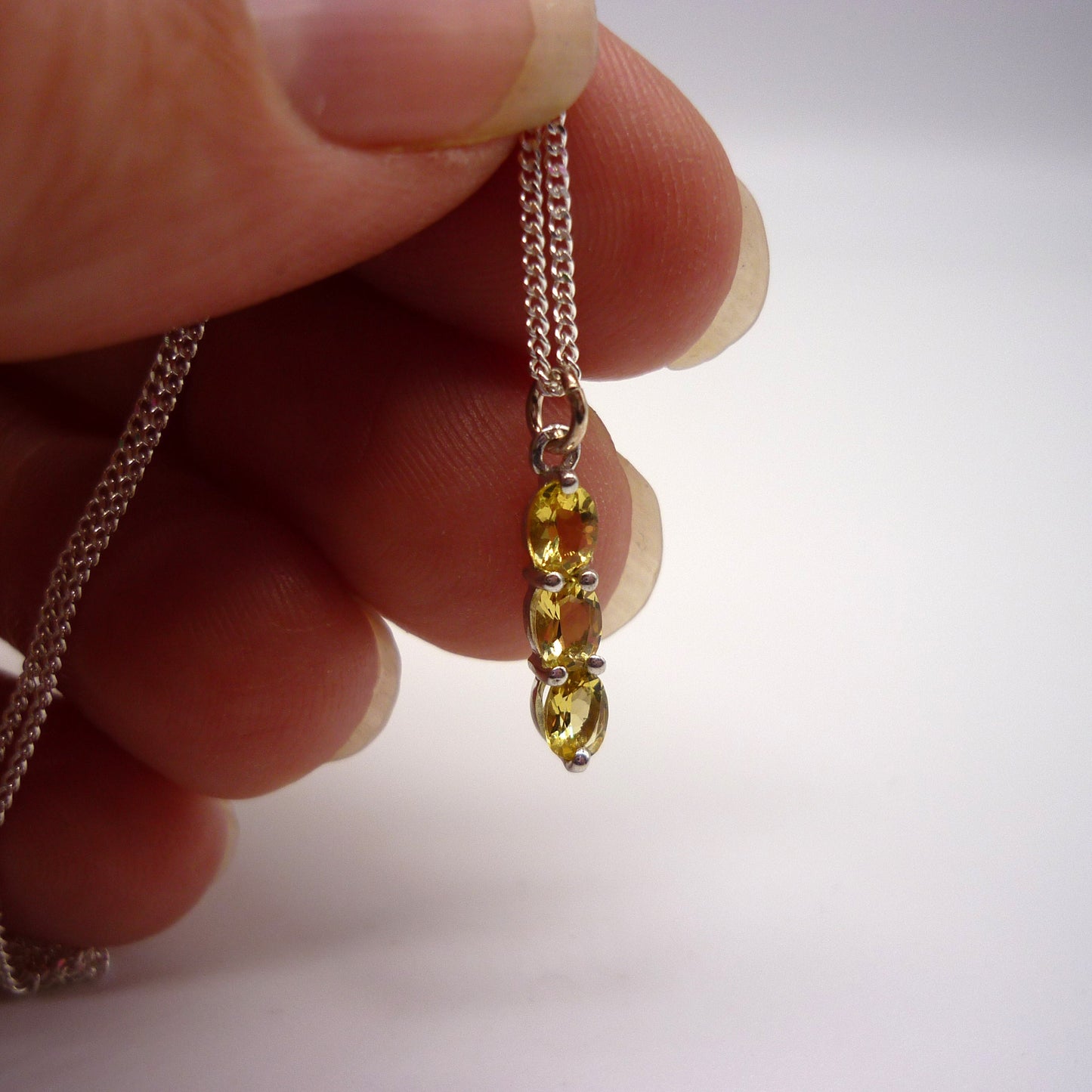 Dainty Silver Pendant set with Yellow Gemstones on a Thin Silver Chain