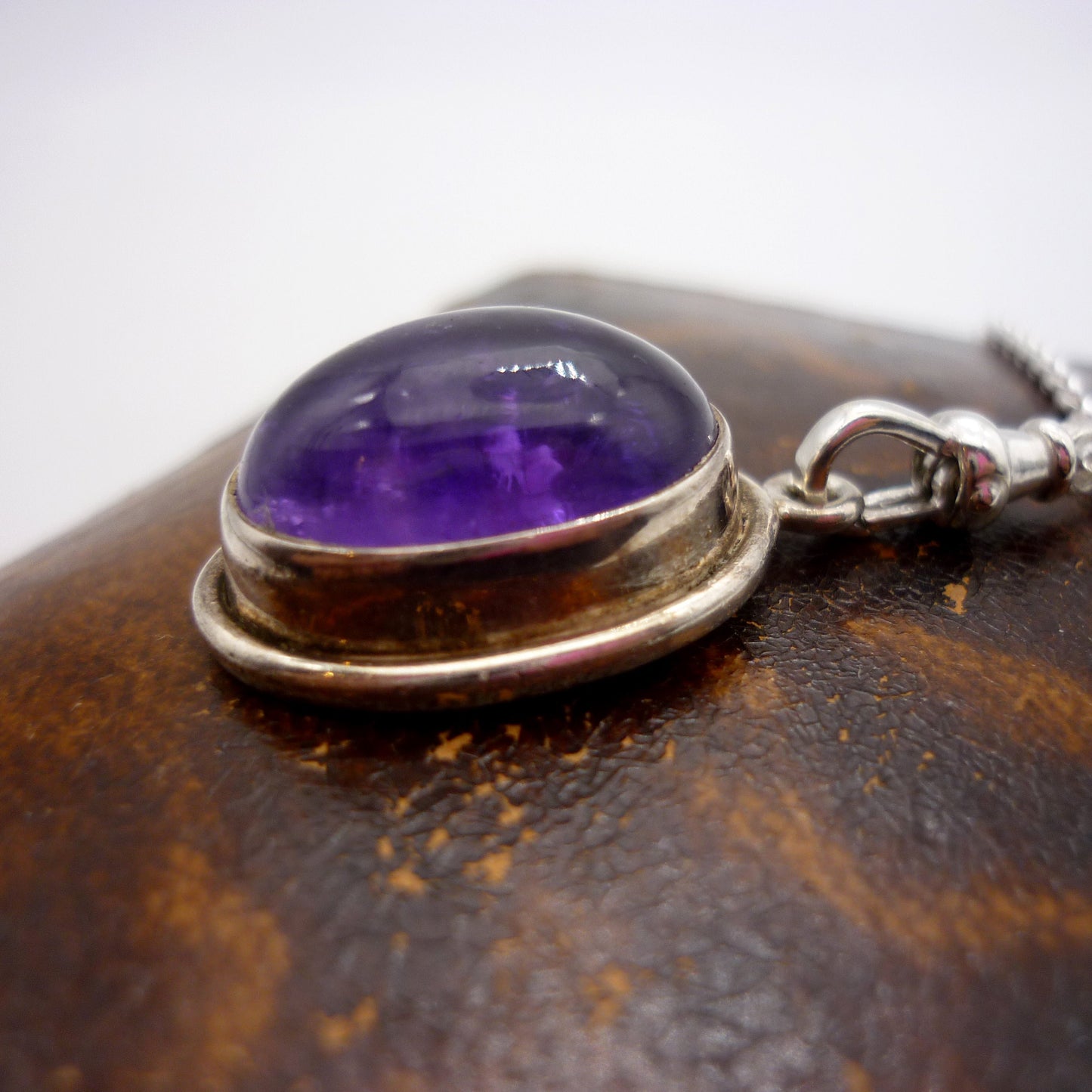 Amethyst Cabochon Pendant on a Long Silver Belcher Chain with Small Albert Clasp