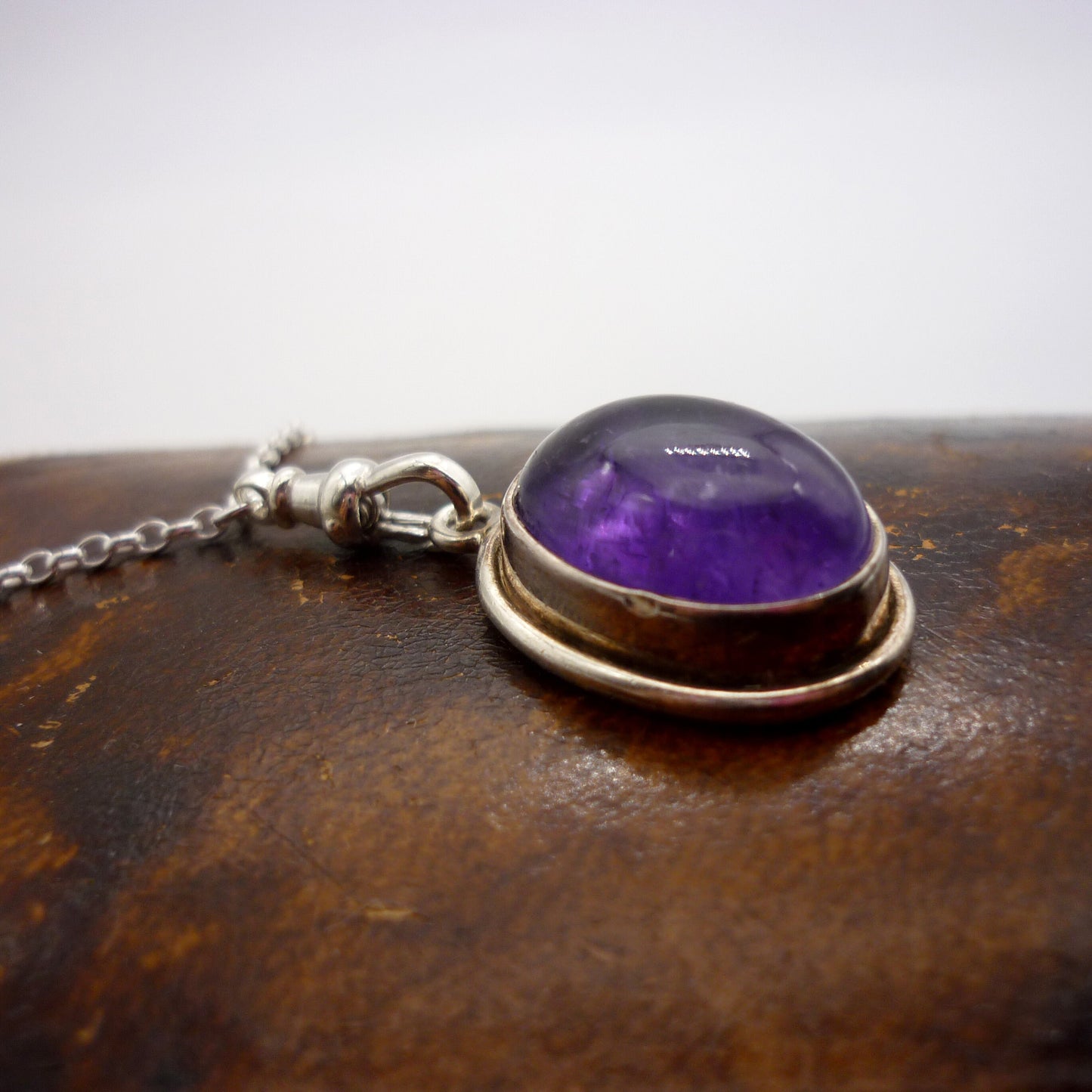 Amethyst Cabochon Pendant on a Long Silver Belcher Chain with Small Albert Clasp
