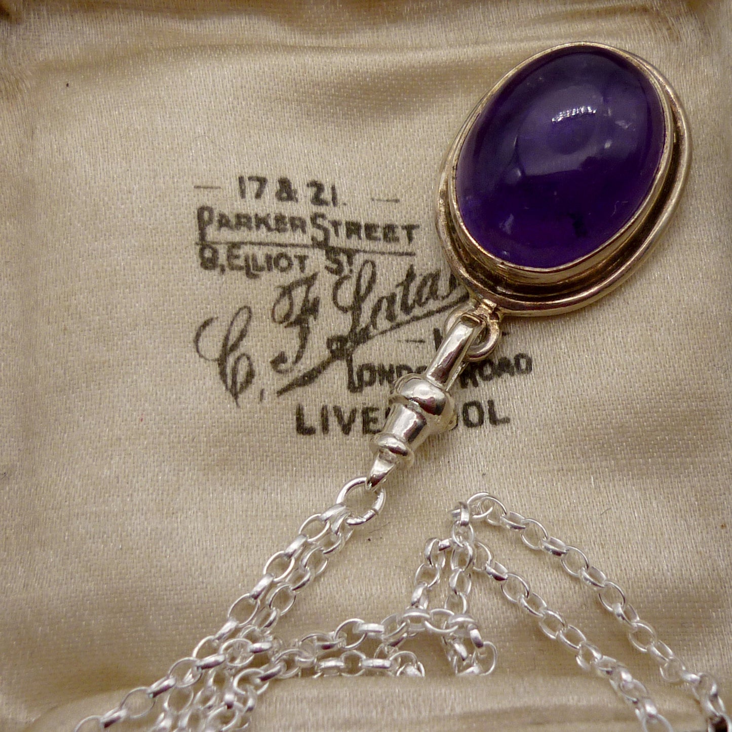 Amethyst Cabochon Pendant on a Long Silver Belcher Chain with Small Albert Clasp