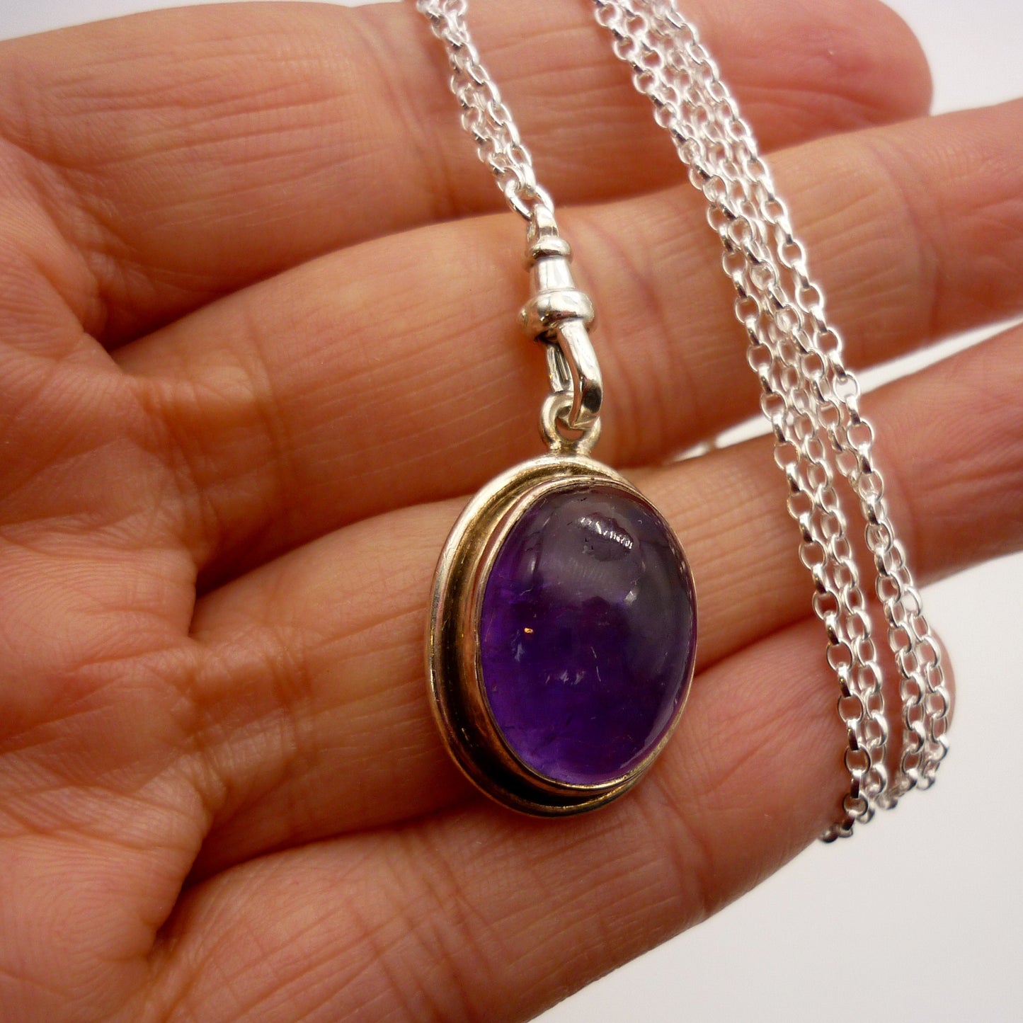 Amethyst Cabochon Pendant on a Long Silver Belcher Chain with Small Albert Clasp