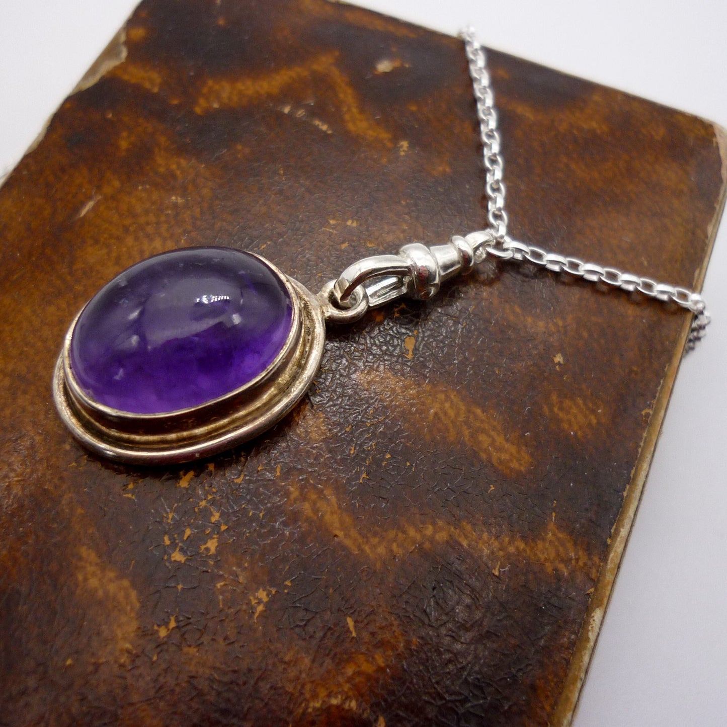 Amethyst Cabochon Pendant on a Long Silver Belcher Chain with Small Albert Clasp