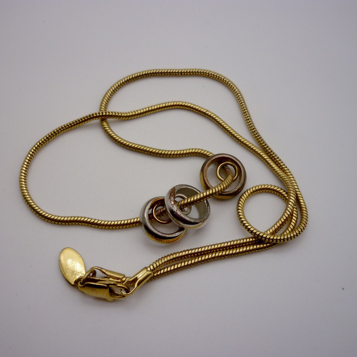 Vintage Gold Tone Snake Chain with Bronze, Silver and Gold Ring Pendants
