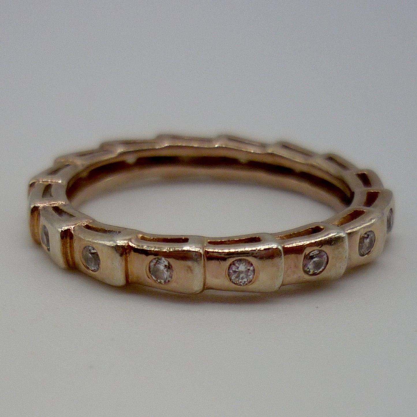 Rose Gold Plated Silver Ring In Ridged Step Pattern Set With Small White Stones