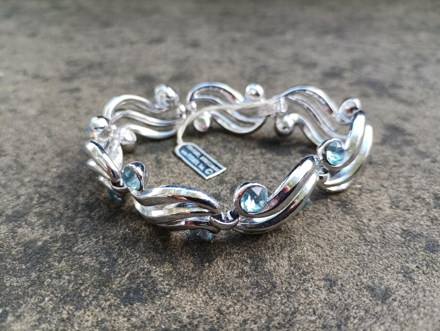 Vintage Crown Trifari Bracelet: Silver Plated Wave Link with Baby Blue Rhinestones