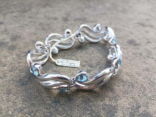Vintage Crown Trifari Bracelet: Silver Plated Wave Link with Baby Blue Rhinestones
