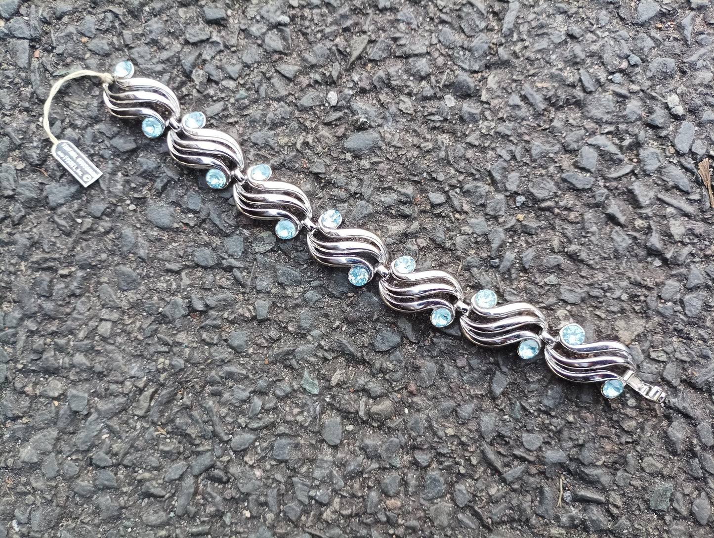 Vintage Crown Trifari Bracelet: Silver Plated Wave Link with Baby Blue Rhinestones