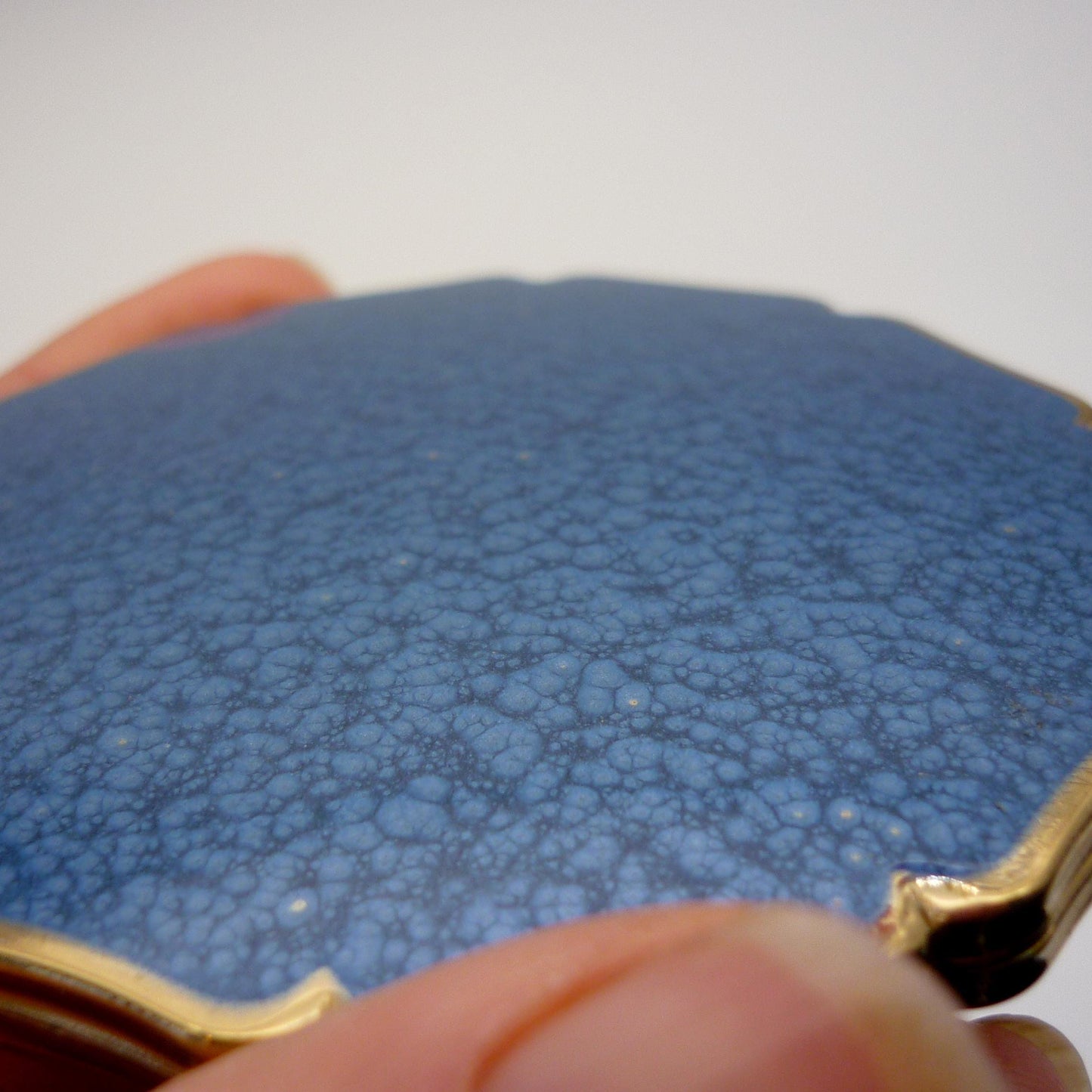 Vintage Stratton Compact in Hand with Blue Enamel Lid